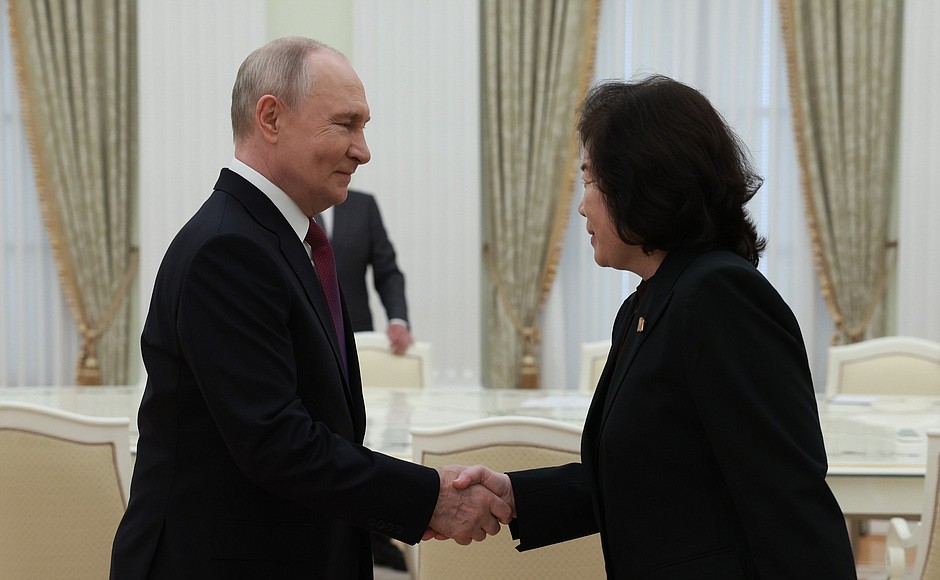 With dprk foreign minister choe son hui photo alexander shcherbak tass | nk insider two suited leaders shake hands in a formal meeting room with gold curtains in the background
